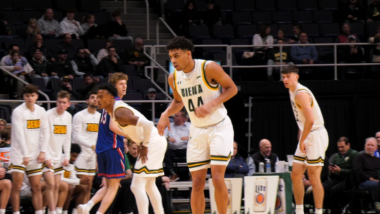 marcus jackson looks upcourt during a siena basketball game