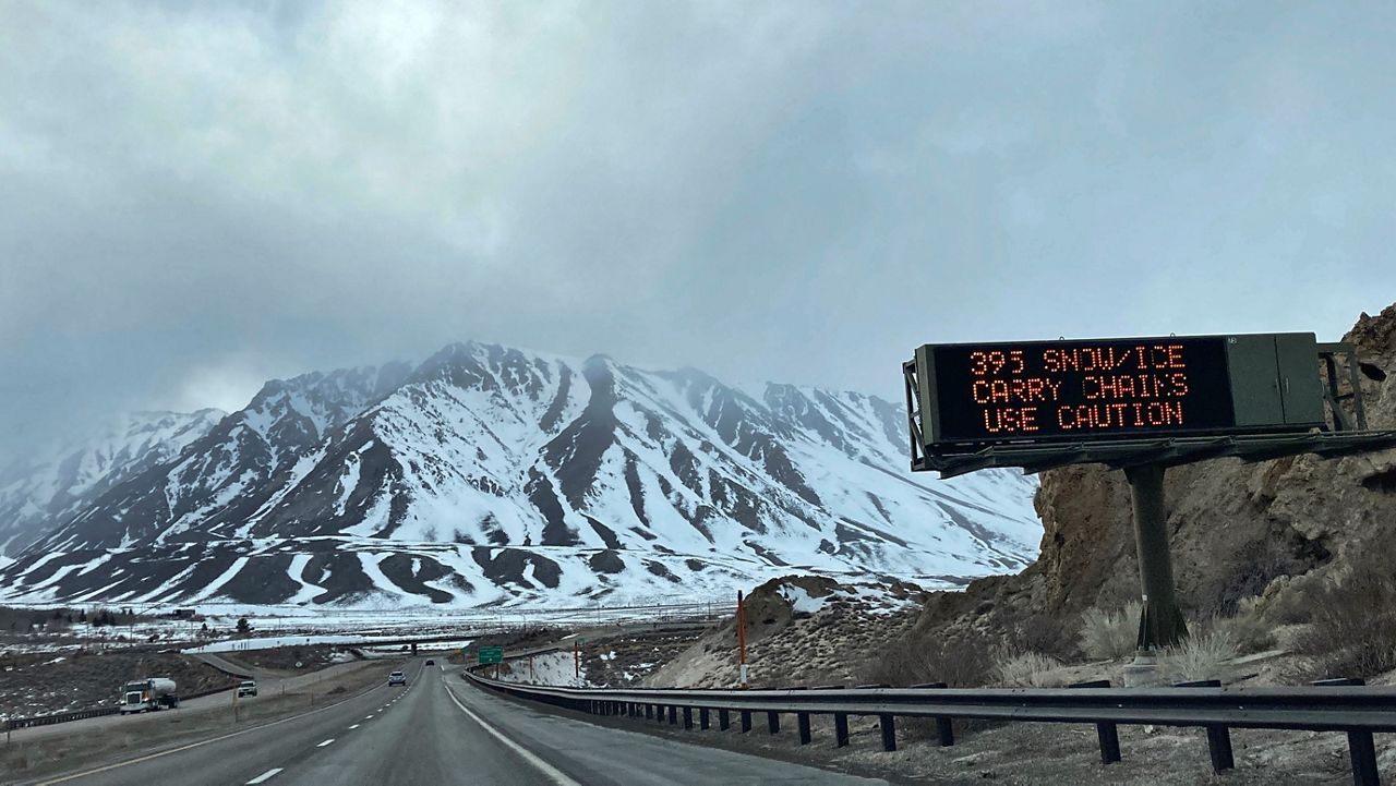 Storm clouds are seen over the Eastern Sierra in Southern Mono county, Calif. on Tuesday, Feb. 22, 2022, near Mammoth Lakes. A cold storm brought snow and rain to California on Tuesday and forecasters warned that freezing temperatures will follow. (AP Photo/Christopher Weber)