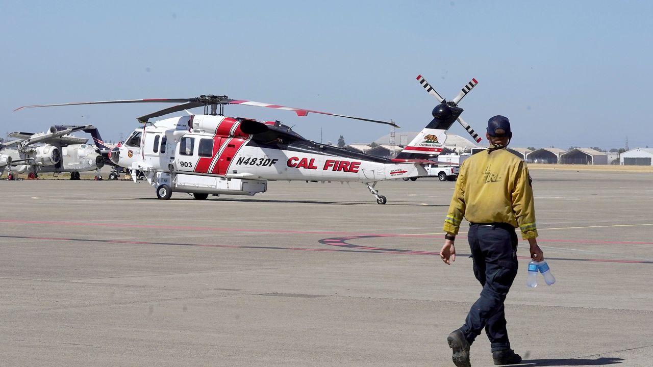 A Sikorsky Firehawk helicopter sits on the tarmac at the California Department of Forestry and Fire Protection's Sacramento Aviation Management Unit based at McClellan Airpark in Sacramento, Calif., Friday, July 23, 2021. (AP Photo/Rich Pedroncelli)