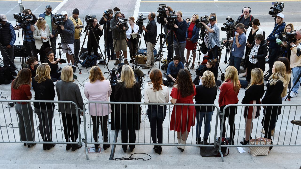 A group of women who have spoken out about Hollywood producer Harvey Weinstein's sexual misconduct and who refer to themselves as the "Silence Breakers," face the media during a news conference at Los Angeles City Hall, Feb. 25, 2020. (AP Photo/Chris Pizzello)