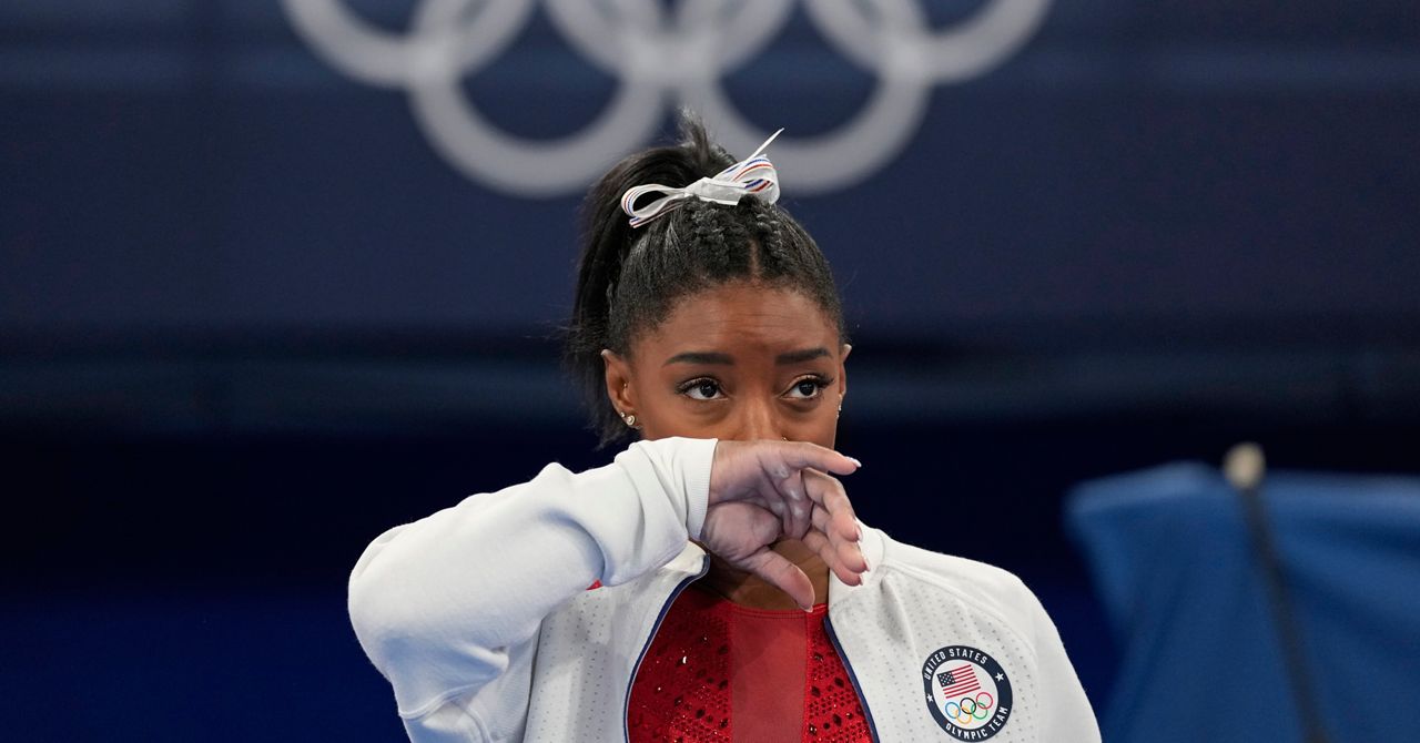 Simone Biles watches gymnasts perform at the 2020 Summer Olympics on Tuesday in Tokyo. (AP Photo/Ashley Landis)