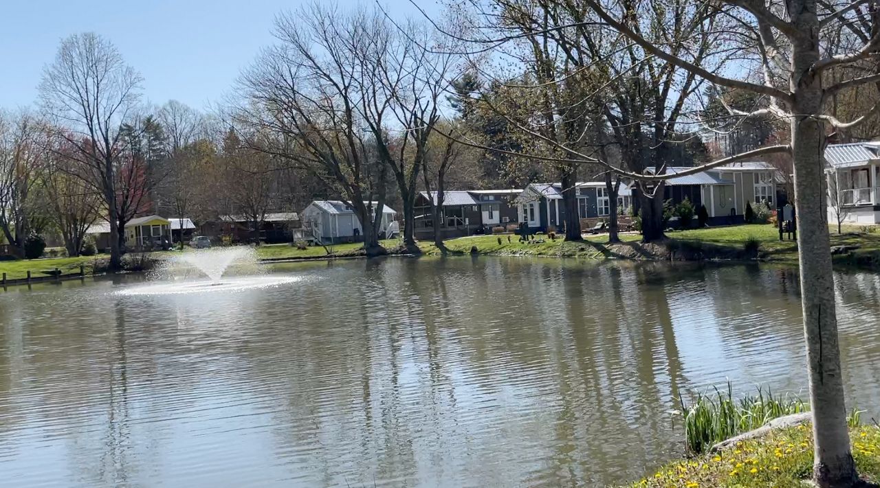 A view of the pond and cottage homes surrounding it. 