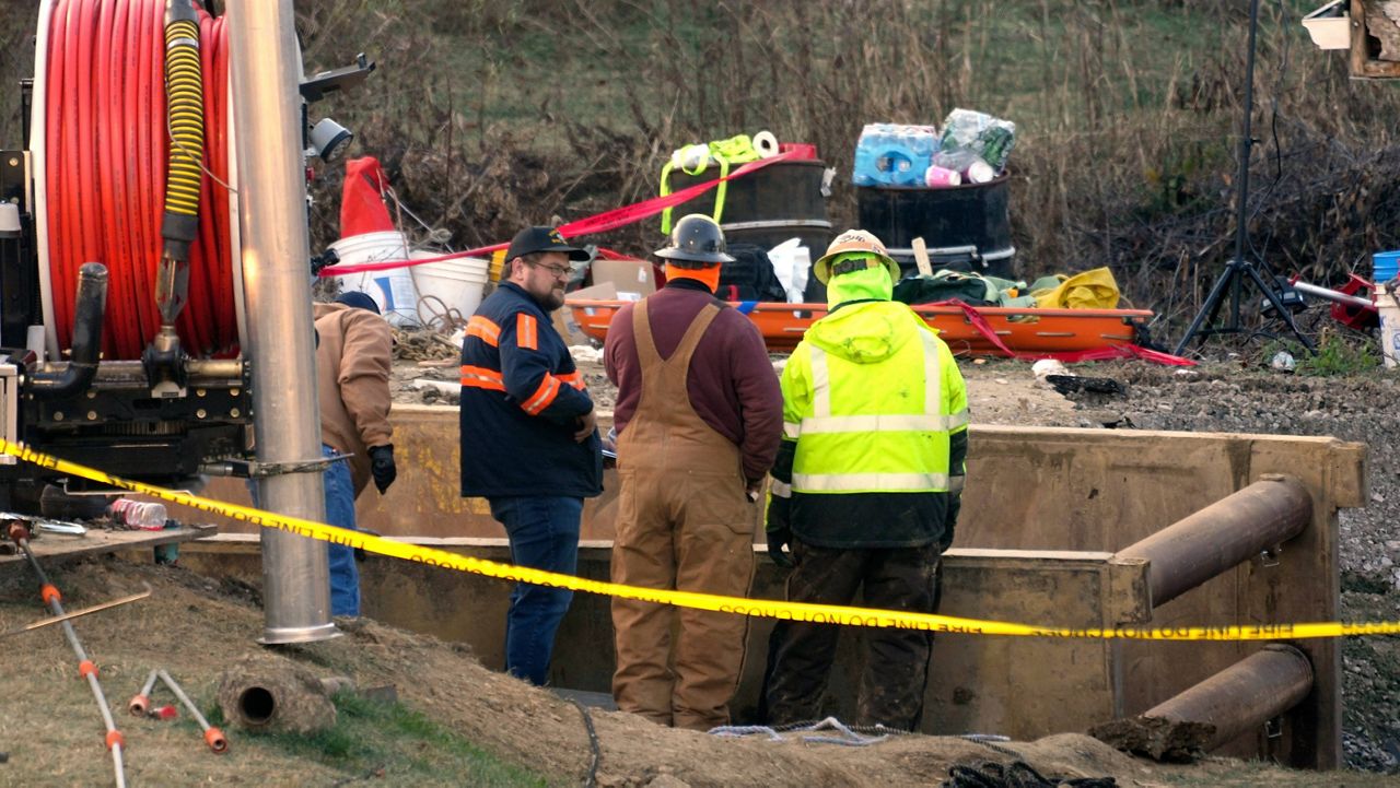 Rescue workers continue to search, Wednesday, Dec. 4, 2024, for Elizabeth Pollard, who is believed to have disappeared in a sinkhole while looking for her cat, in Marguerite, Pa. (AP Photo/Gene J. Puskar)