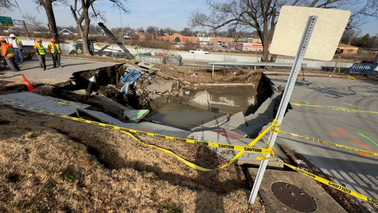 A six-inch water main break happened at Idaho Avenue and Blow Street that caused a large sinkhole Wednesday from erosion in south St. Louis. (Spectrum News photo)