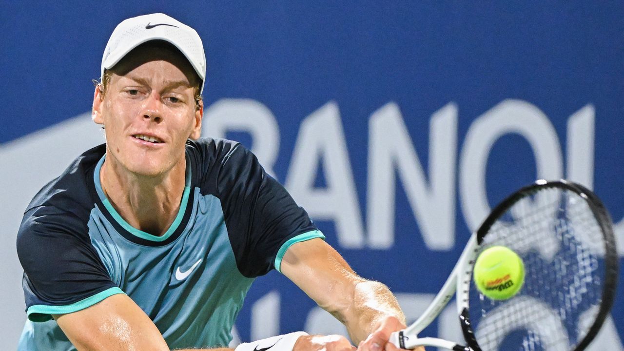 Jannik Sinner, of Italy, plays a shot to Andrey Rublev, of Russia, during their quarterfinal match at the National Bank Open tennis tournament in Montreal, Saturday, Aug. 10, 2024. (Graham Hughes/The Canadian Press via AP)