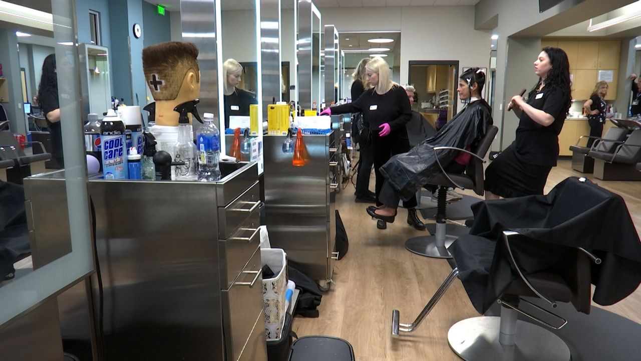 Anne Marie and Mary work on a customers hair at Madison Technical College. 