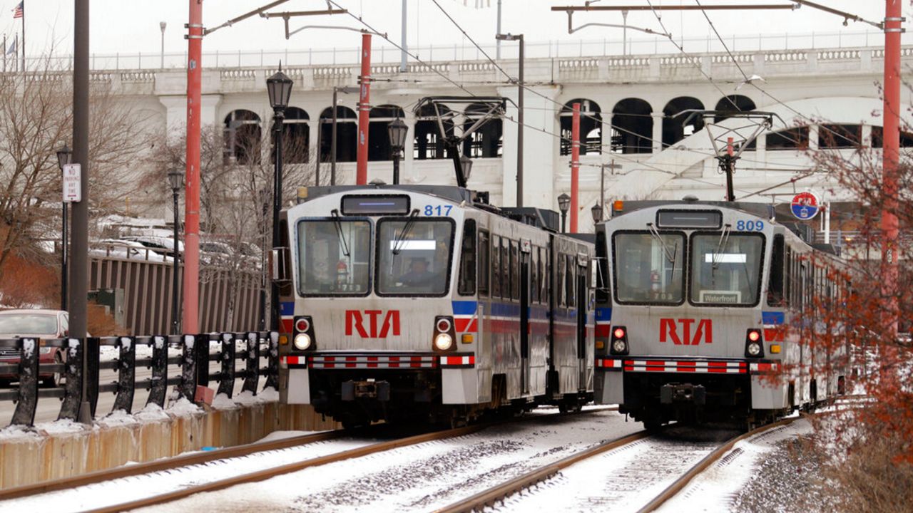 Two Greater Cleveland RTA rapid-transit trains pass on the Lakefront Line in Cleveland Wednesday, Jan. 8, 2014.