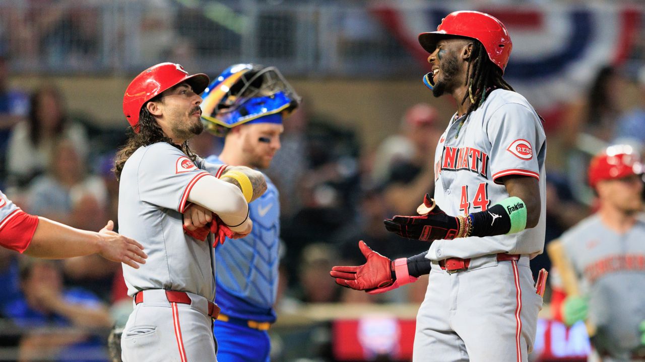 Cincinnati Reds Elly De La Cruz (44) celebrates with teammates after hitting a grand slam during the seventh inning of a baseball game against the Minnesota Twins, Friday, Sept. 13, 2024, in Minneapolis.