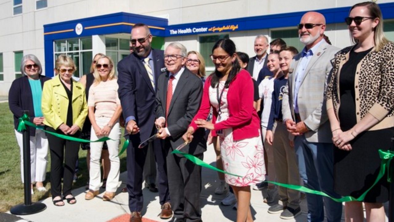 Gov. Mike DeWine and community leaders cut the ribbon at the Health Center at Springfield High.