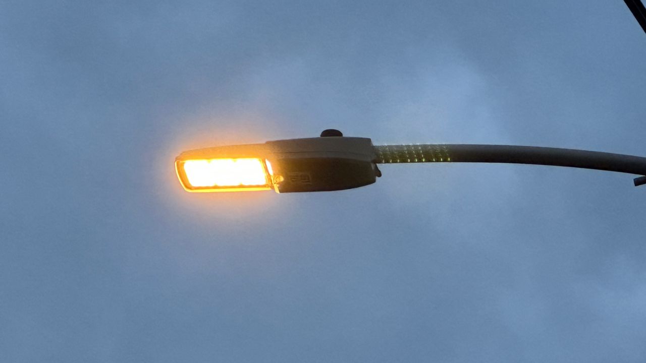 One of the new LED remote-controlled streetlights located outside of the Hilltop library branch. 