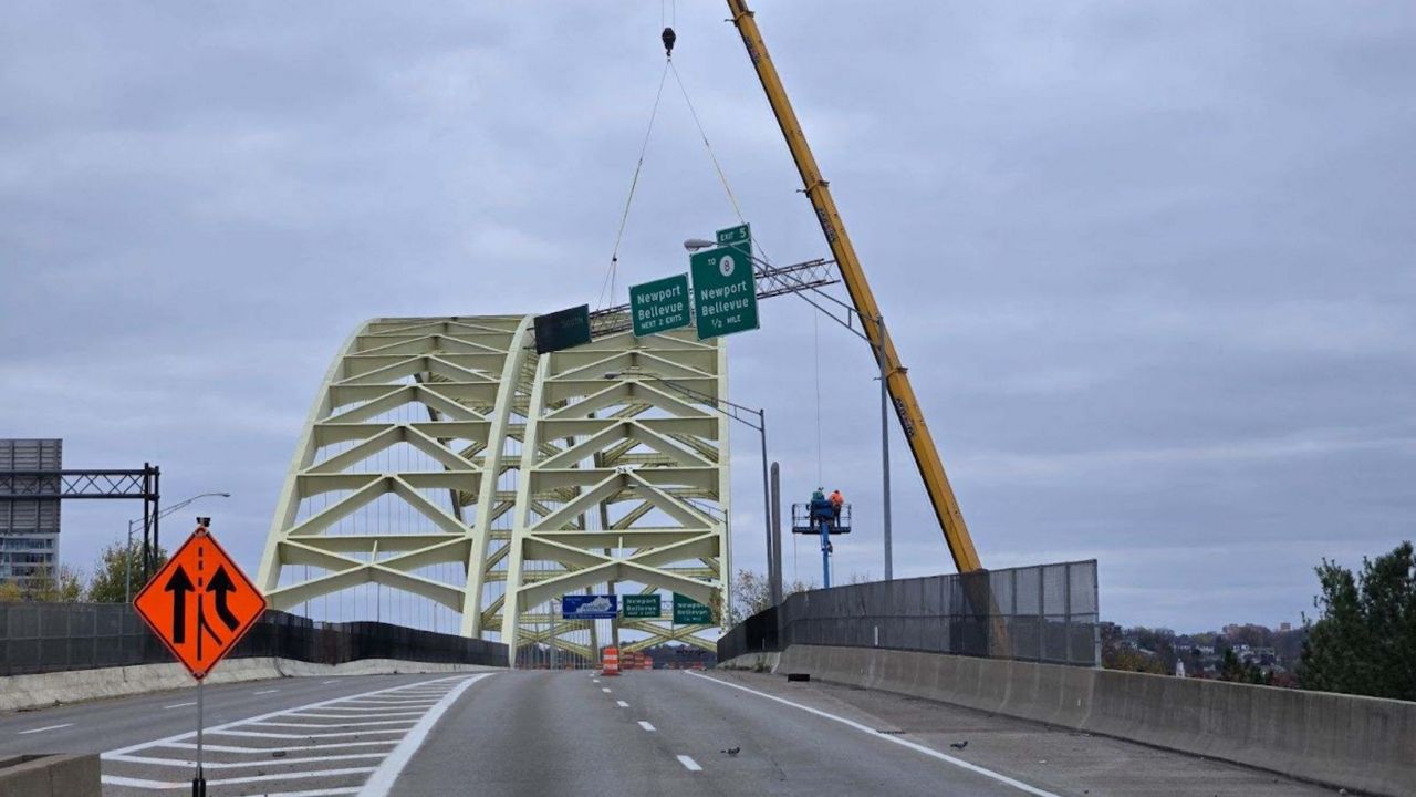 The damaged truss is removed from Ohio's approach to the Daniel Carter Beard Bridge, which connects Cincinnati with Newport, Kentucky. 