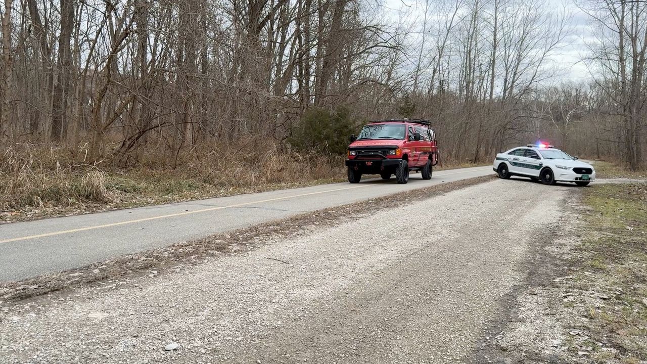 St. Louis Fire Department's Search and Rescue passes a Park Ranger vehicle at the scene of skeletal remains found in Creve Coeur Park