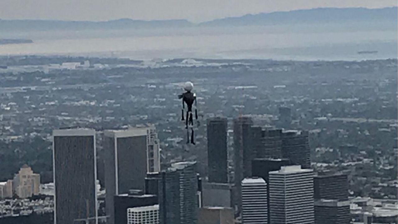 A balloon that looks like Jack Skellington floating above the skyline