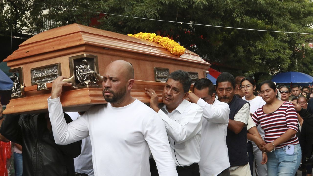 Relatives of slain Mayor Alejandro Arcos carry his coffin during his funeral service, one week after he took office, in Chilpancingo, Guerrero state, Mexico, Monday, Oct. 7, 2024. (AP Photo/Alejandrino Gonzalez)