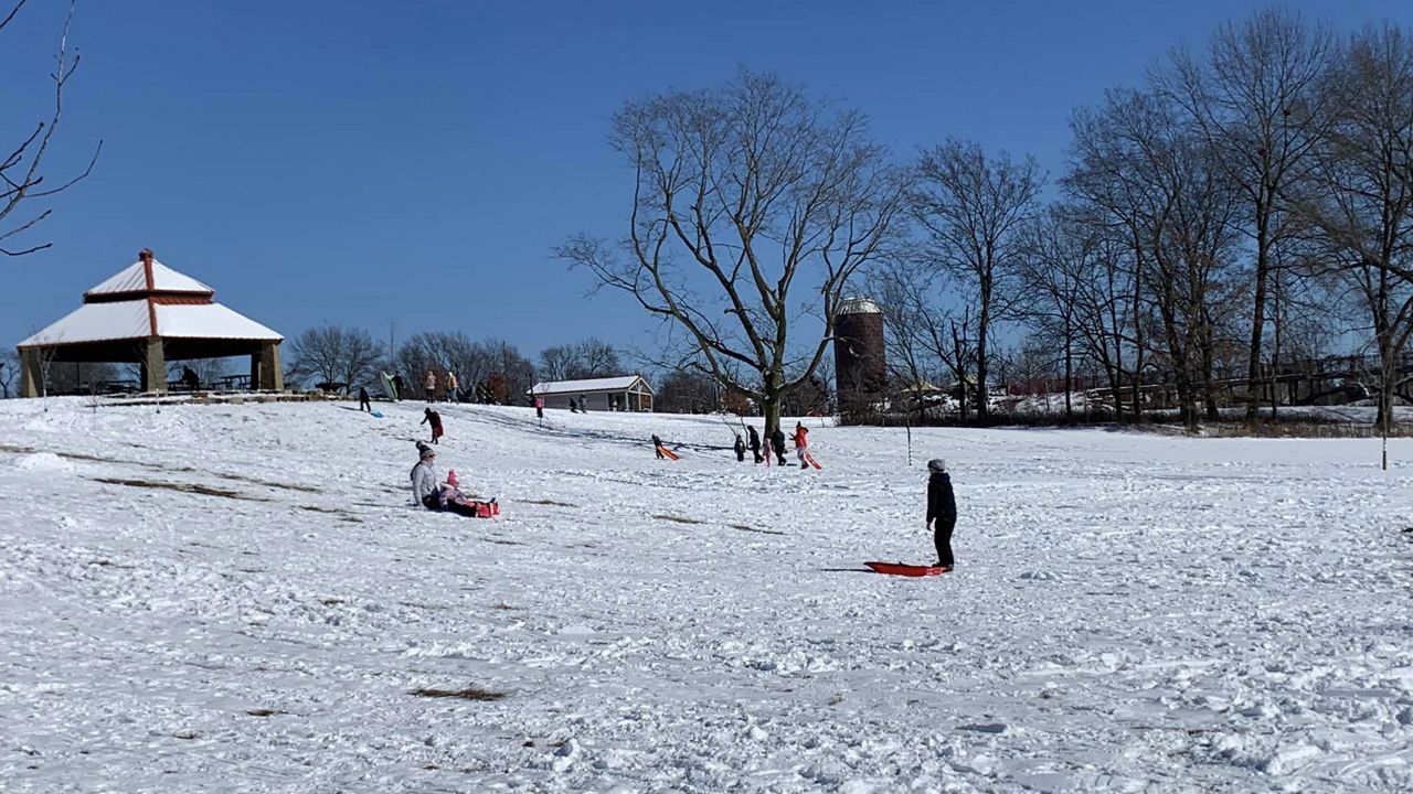 People sled ridding at Veterans Tribute Park in Weldon Springs, Mo. on Feb. 17, 2024. (Spectrum News/Stacy Lynn)