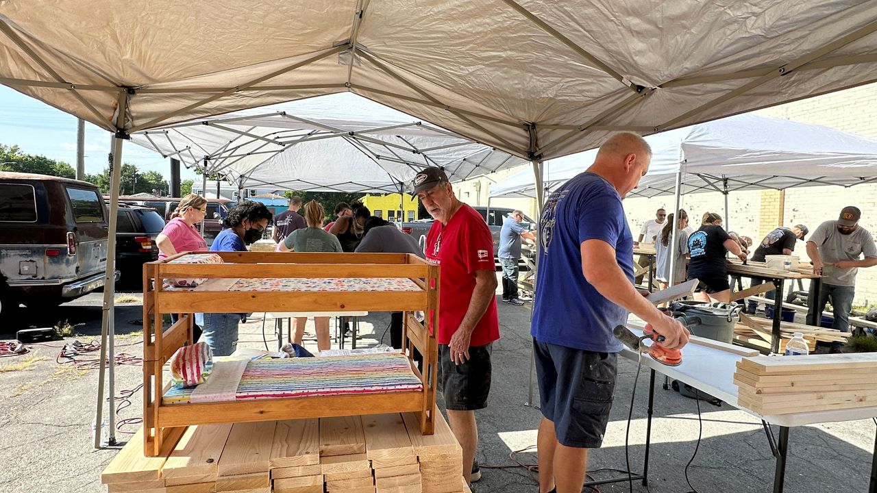 Unions and nonprofits build beds for children in Louisville