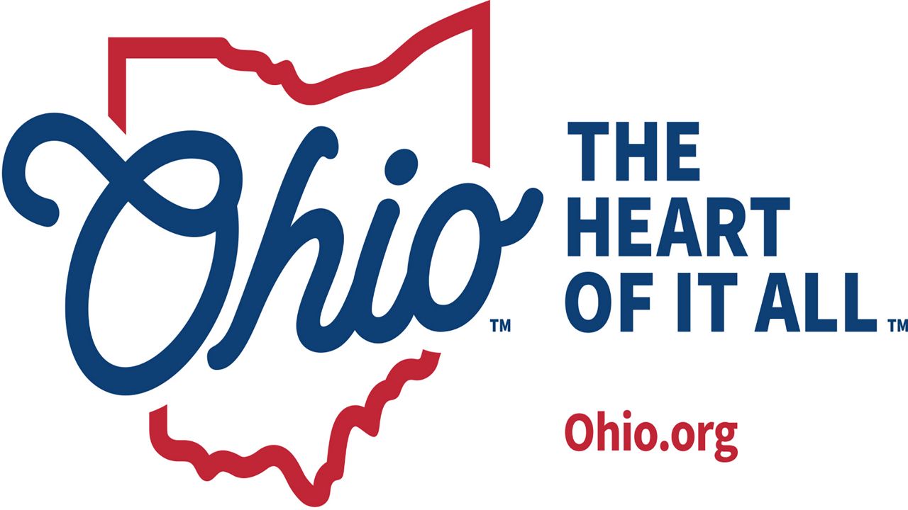 "Ohio" written in cursive across the shape of Ohio with the words "the heart of it all" to the right
