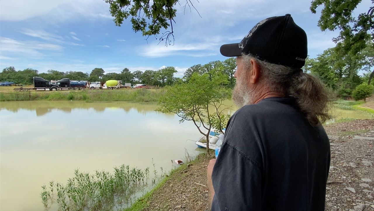 Mr. Larre E. Smitherman Sr. by his fishing pond across from the site where the concrete batch plant would be located. (Spectrum News 1/Magaly Ayala)
