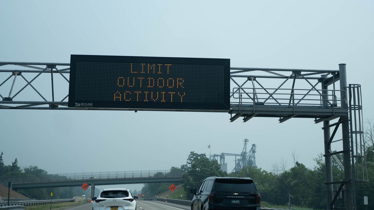 Smoke in the air keeping many indoors, but some people continue outdoor activities