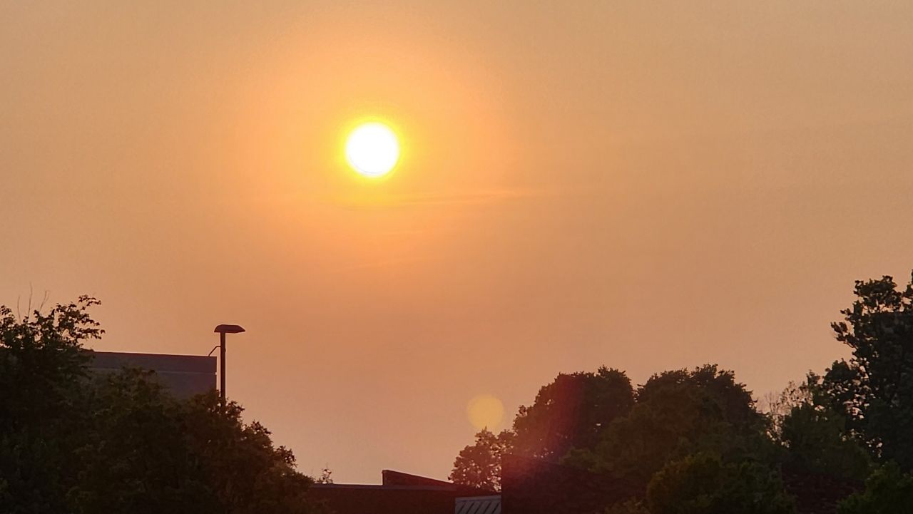 The sun sets in a hazy sky from Canadian wildfire smoke drifting south into the Ohio Valley. (Spectrum News/Chris Havely)