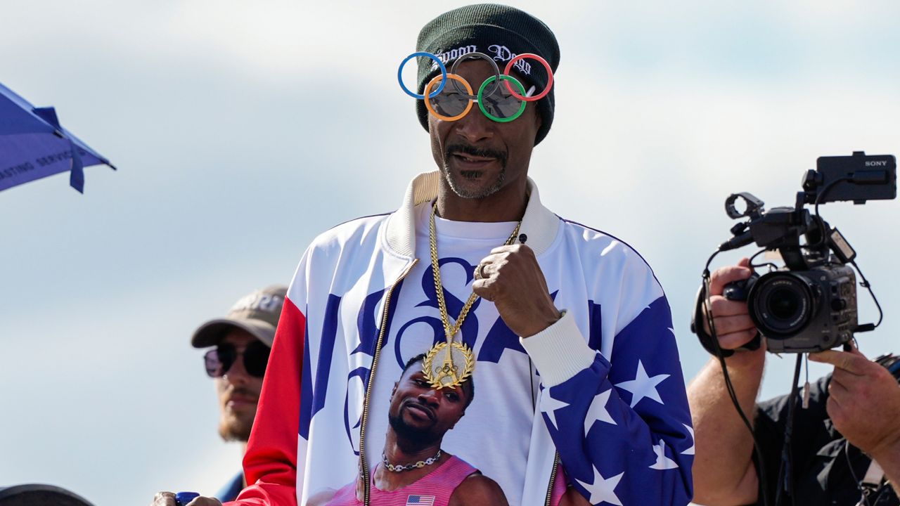 U.S. artist Snoop Dogg gestures during the men's skateboarding park finals at the 2024 Summer Olympics, on Wednesday in Paris, France. (AP Photo/Frank Franklin II)