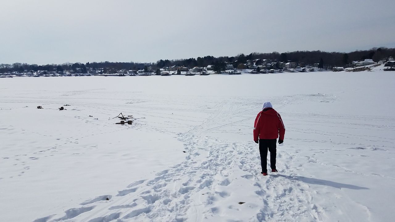 Apple Valley Lake in Howard, Ohio, freezes over in 2021 with a fresh layer of snow on top.