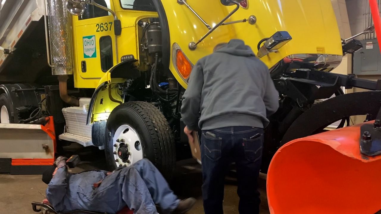 Workers check the snow plows in preparation for the winter. (Spectrum News 1/Katie Priefer)