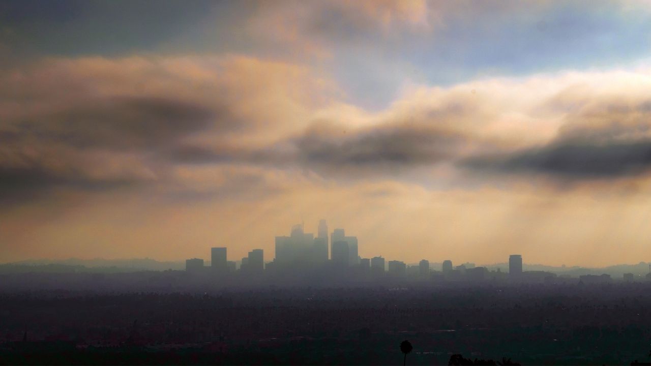 Downtown Los Angeles is shrouded in early morning coastal fog on Aug. 12, 2016. (AP Photo/Richard Vogel)