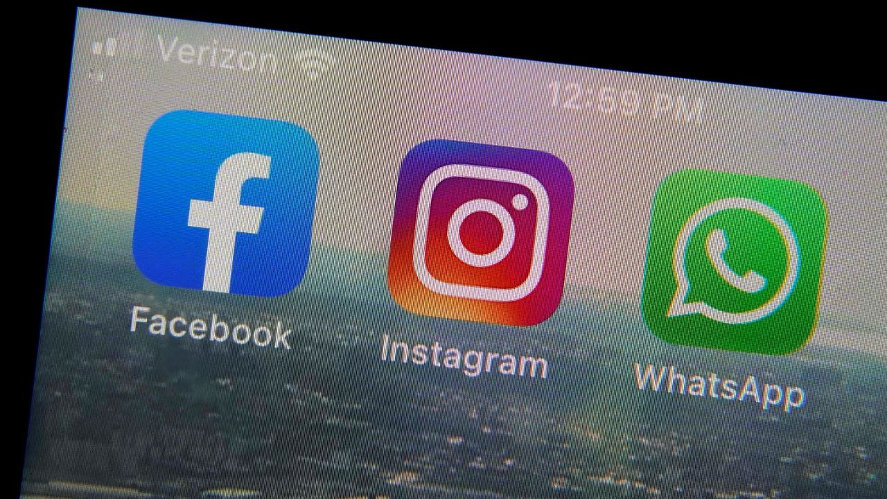 This Tuesday, Oct. 5, 2021 file photo shows the mobile phone app logos for, from left, Facebook, Instagram and WhatsApp in New York.  (AP Photo/Richard Drew)