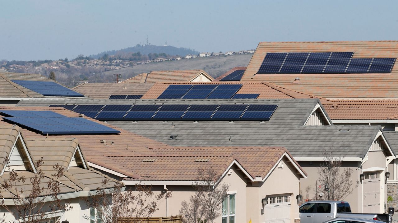 Solar panels on rooftops (AP Photo/Rich Pedroncelli)