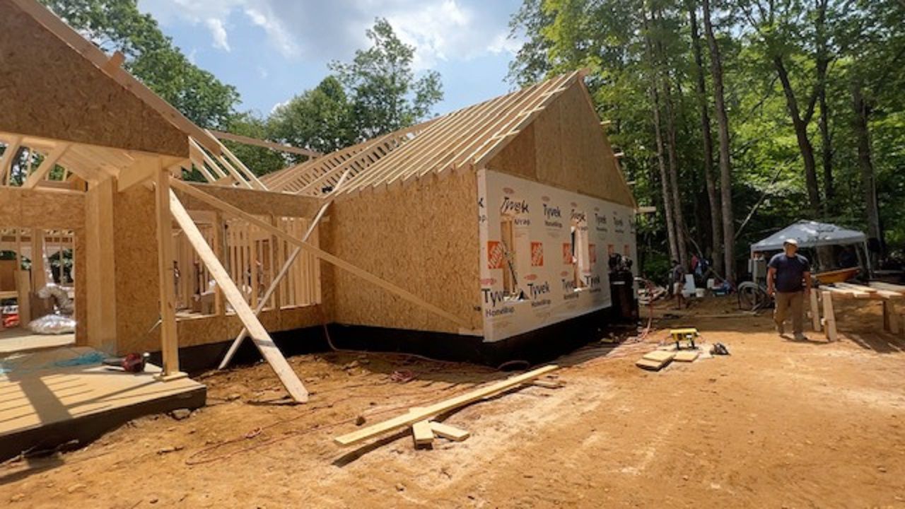 Volunteers gather to build home for veteran