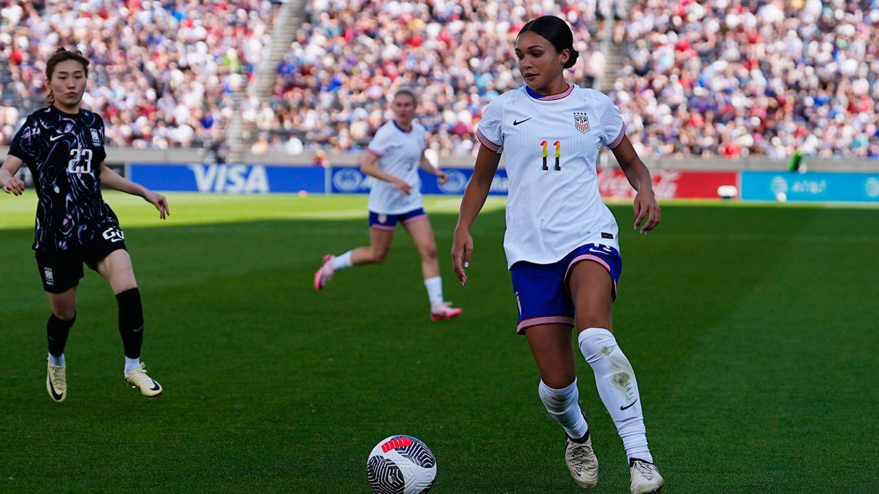 United States forward Sophia Smith, right, collects the ball as South Korea forward Kang Chaerim, left, comes in to defend in the second half of an international friendly soccer game Saturday, June 1, 2024, in Commerce City, Colo. (AP Photo/David Zalubowski)