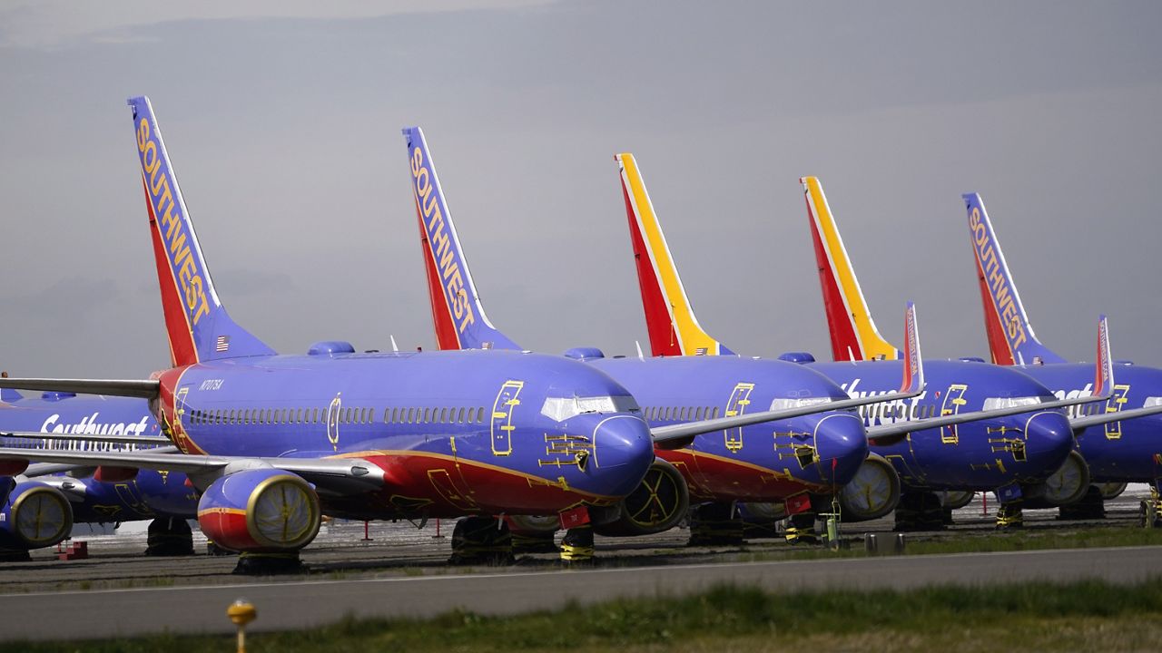 A line of Southwest Air Boeing 737 jets are parked near the company's production plant while being stored at Paine Field Friday, April 23, 2021, in Everett, Wash. Southwest Air reports earnings on Thursday, April 25, 2024. (AP Photo/Elaine Thompson, File)