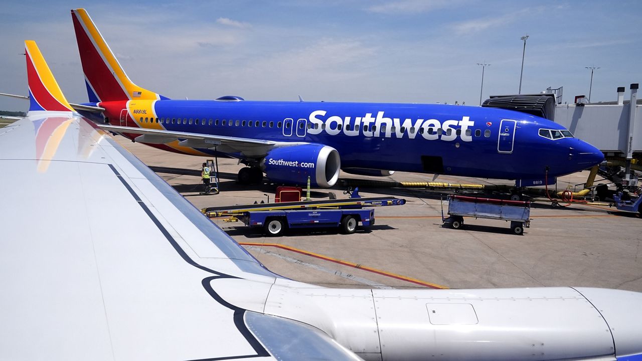 A Southwest Airlines Boeing 737 passenger jet sits at a gate at the Tulsa International Airport Saturday, June 15, 2024, in Tulsa. (AP Photo/Charles Rex Arbogast)