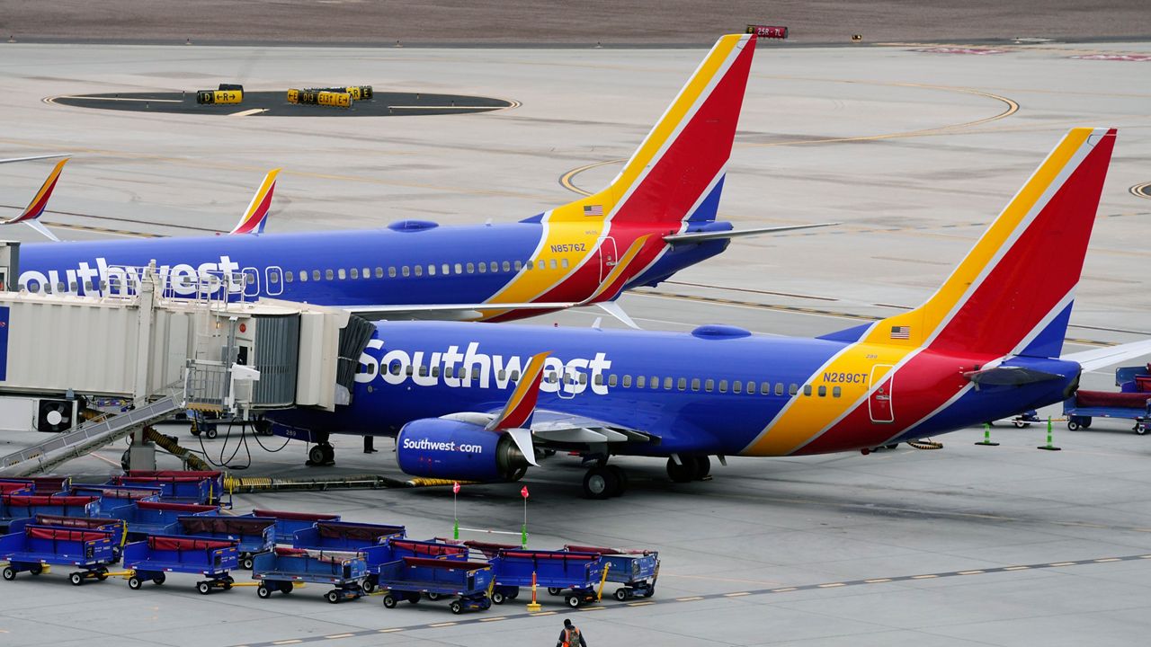 Southwest Airlines jets are parked at gates at Phoenix Sky Harbor International Airport in Phoenix, Thursday, Dec. 29, 2022. (AP Photo/Ross D. Franklin)