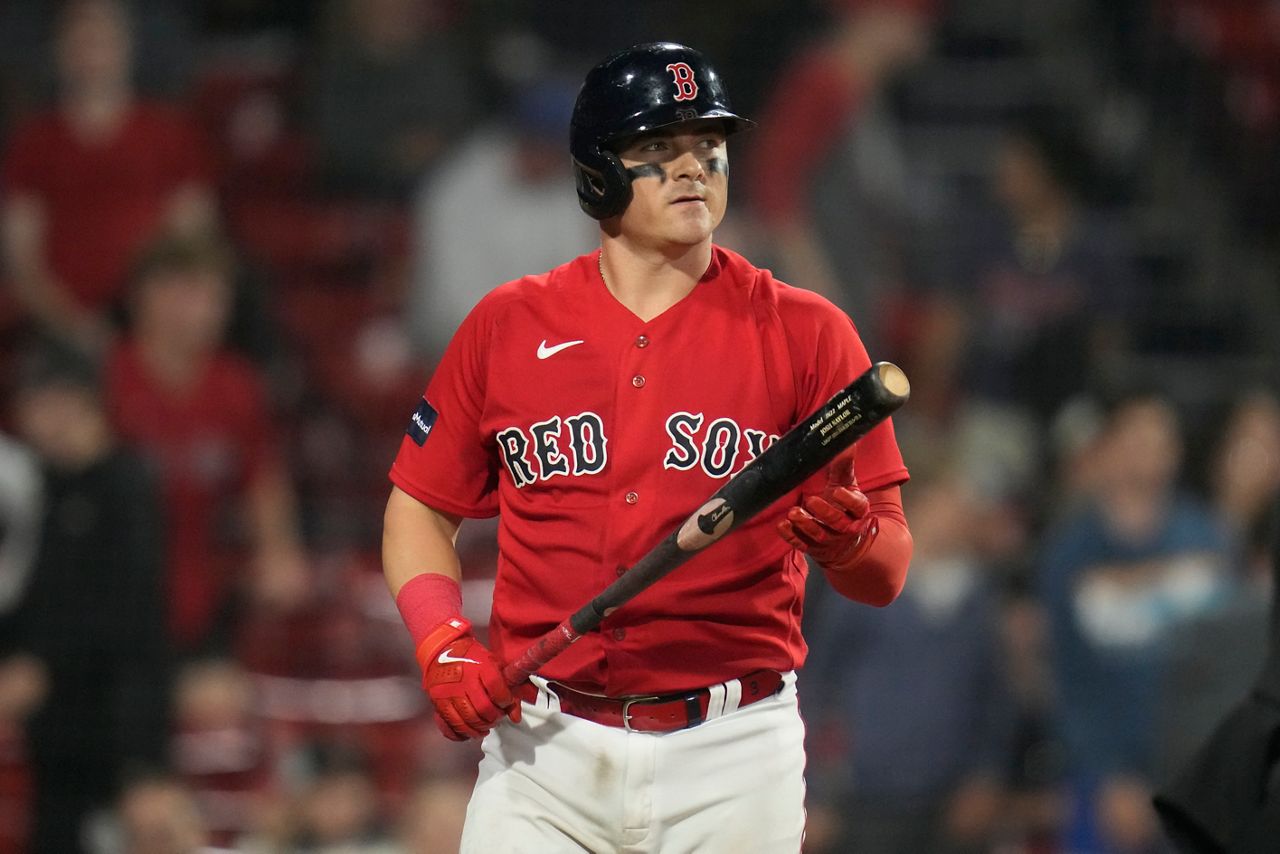 Rafael Devers of the Boston Red Sox heads for the dugout during