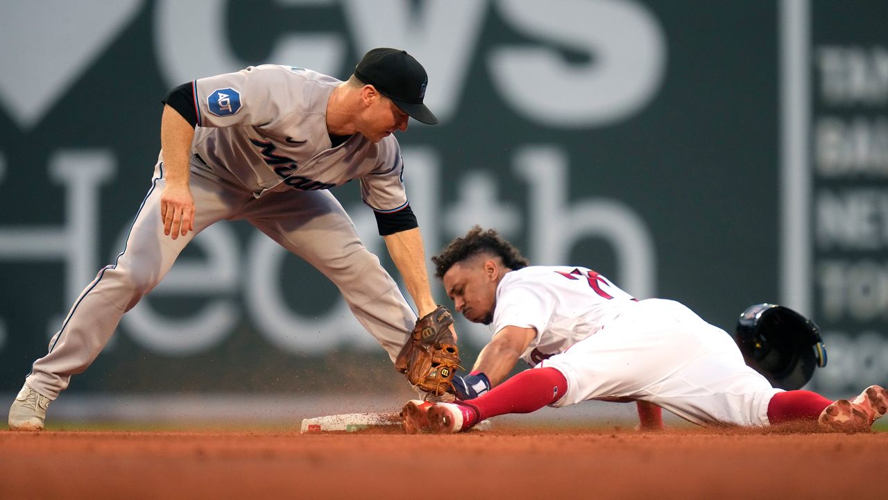 Miami Marlins baseball infielder Jean Segura puts on a Marlins