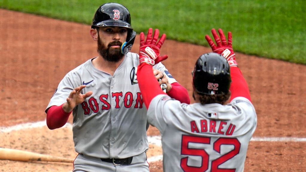 Boston Red Sox's Connor Wong, left, celebrates with Wilyer Abreu (52) after they scored on a single by teammate Reese McGuire off Pittsburgh Pirates relief pitcher Ryder Ryan during the fifth inning of a baseball game in Pittsburgh, Sunday, April 21, 2024. (AP Photo/Gene J. Puskar)