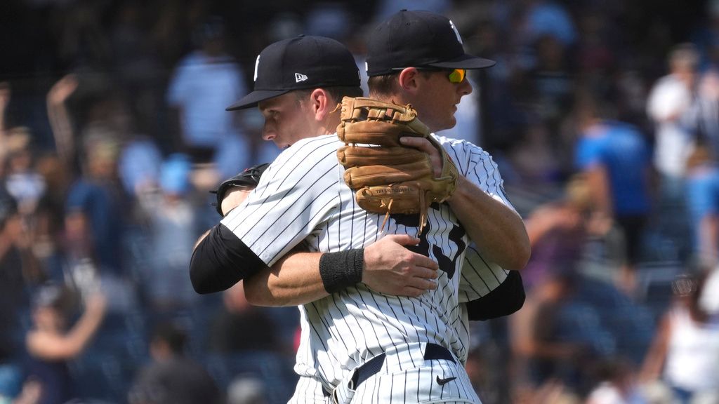 New York Yankees' Ben Rice, front, and DJ LeMahieu celebrate following a baseball game against the Boston Red Sox, Saturday, July 6, 2024, in New York. Rice became the first Yankees rookie to homer three times in a game and drove in seven runs as New York snapped a four-game slide with a 14-4 victory over the Boston Red Sox on Saturday.  (AP Photo/Pamela Smith)