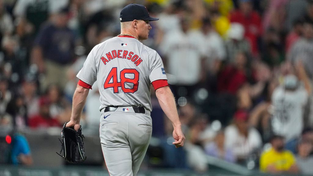 Boston Red Sox relief pitcher Chase Anderson heads to the dugout after giving up a walkoff RBI single to Colorado Rockies' Ezequiel Tovar in the 12th inning of a baseball game Monday, July 22, 2024, in Denver. (AP Photo/David Zalubowski)