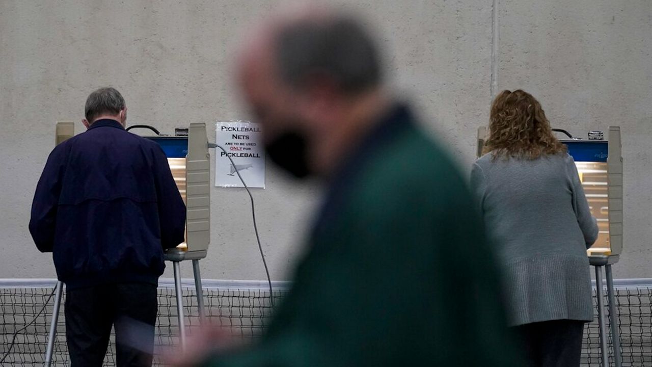 In this Nov. 3, 2020 file photo, people vote at the Milwaukee County Sports Complex in Franklin, Wis. (AP Photo/Morry Gash File)