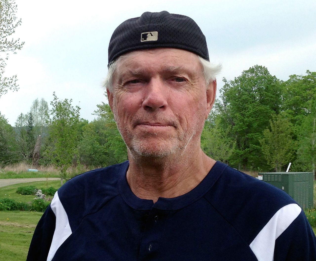 FILE - Former Boston Red Sox pitcher Bill "Spaceman" Lee poses May 25, 2016, at his home in Craftsbury, Vt. Lee collapsed on the field during ceremonies before a Triple-A game between the Worcester Red Sox and the Norfolk Tides, Thursday, Aug. 31, 2023. He walked off on his own and was laughing and talking in the dugout after, MassLive.com reported. (AP Photo/Dave Gram, File)