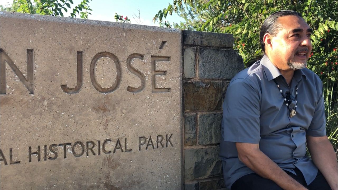 Ramon Vasquez sits in front of Mission San José (Jose Arredondo/Spectrum News)