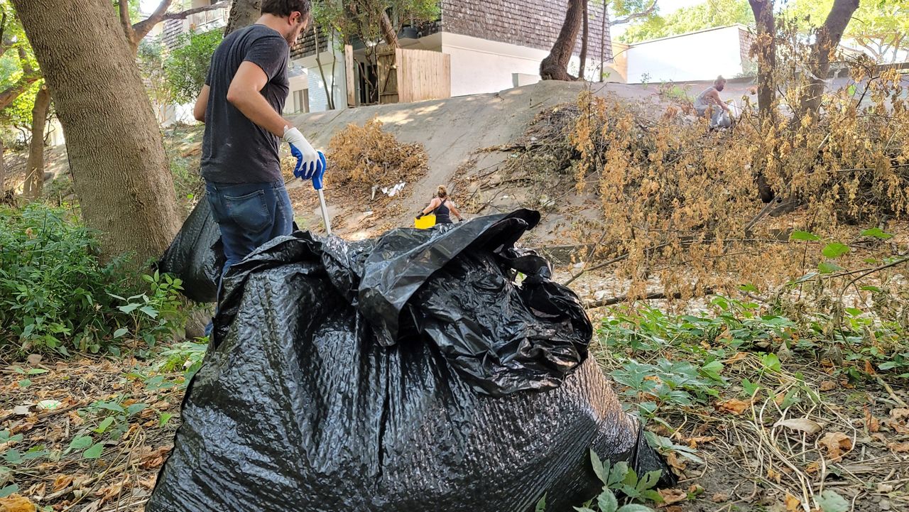 The group Trash Humans cleans up public areas in Austin (Agustin Garfias/Spectrum News)