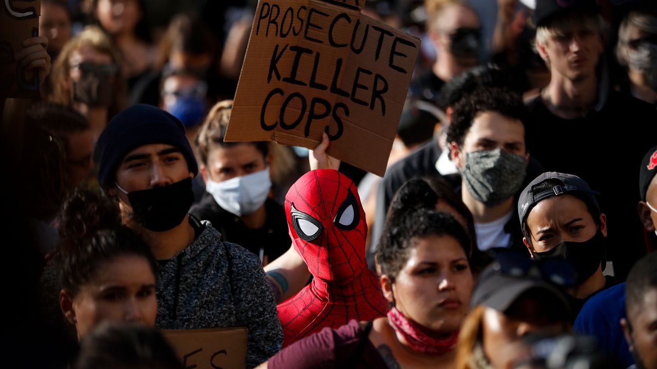 A demonstrator wearing a Spider-Man costume attends a protests Thursday, June 4, 2020, in Los Angeles, over the death of George Floyd on May 25 in Minneapolis. (AP Photo/Jae C. Hong)