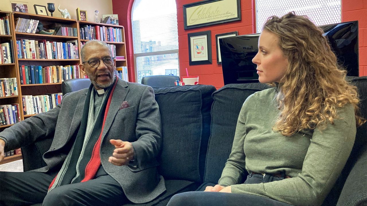 The Rev. Darryl Gray, left, and the Rev. Lauren Bennett speak in Bennett's office in St. Louis, Mo., on Jan. 10, 2023. Both served as spiritual advisers at recent executions in Missouri, sitting alongside the inmates and touching them as the process occurred. Spiritual advisers have been increasingly present during executions since a Supreme Court ruling last year. (AP Photo/Jim Salter