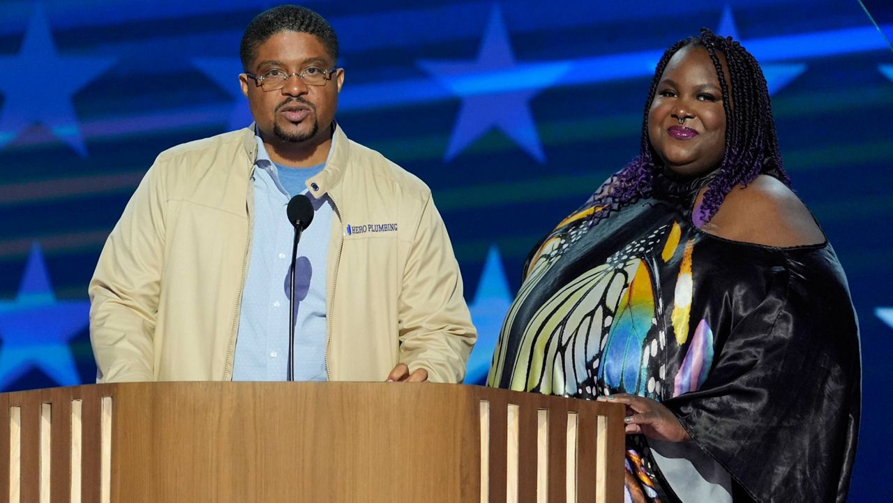 Rashawn Spivey speaks as Deanna Branch looks on during the Democratic National Convention Wednesday, Aug. 21, 2024, in Chicago. (AP Photo/J. Scott Applewhite)