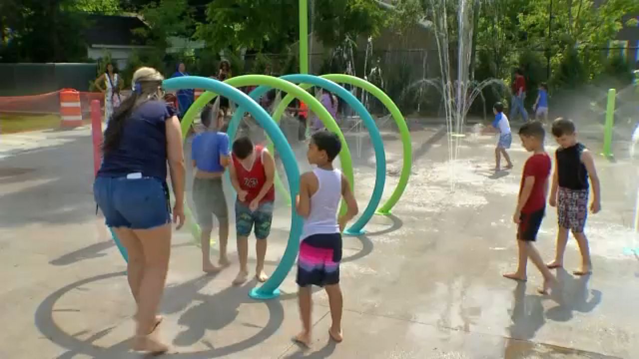 Residents trying to beat the heat at a spray park.