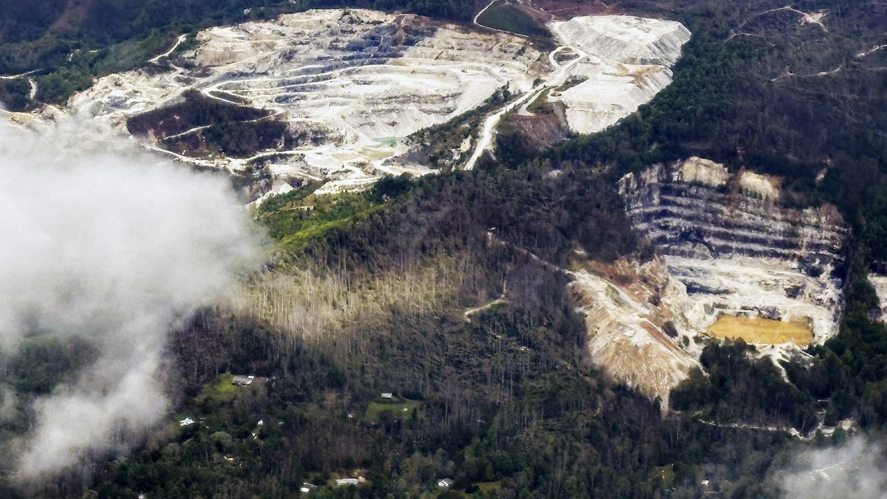 An aerial view of quartz mines in Spruce Pine, N.C., as taken from a plane on Monday, Sept. 30, 2024. (AP Photo/Gary D. Robertson)