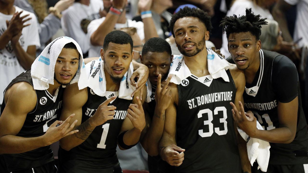 st bonaventure basketball players pose for photo